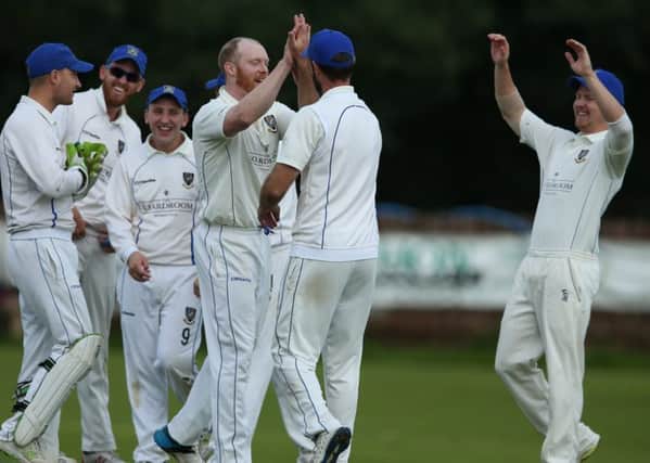 Allen Coulter CIYMS celebrating his wicket against Waringstown