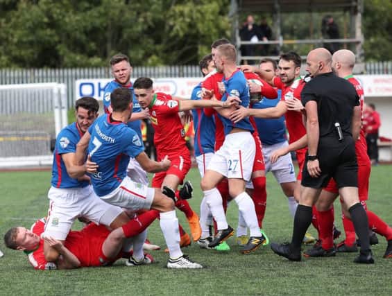 Linfield and Cliftonville players tussle during Saturday's game at Solitude.  Photo by David Maginnis/Pacemaker Press