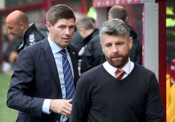 Rangers' manager Steven Gerrard (left) and Motherwell's manager Stephen Robinson.      Jane Barlow/PA Wire.