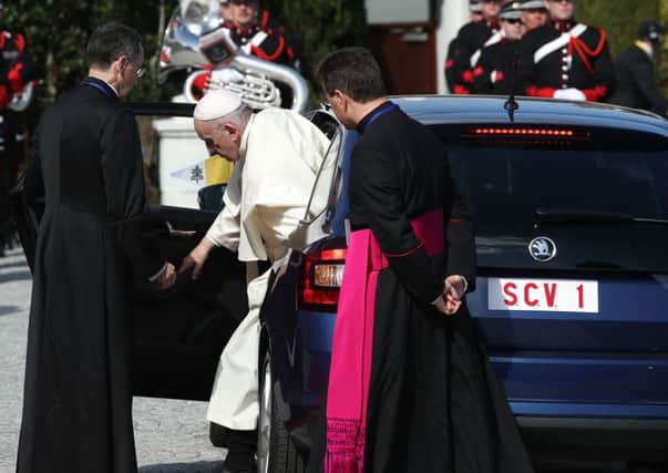 Pope Francis steps out of the Skoda during his weekend visit