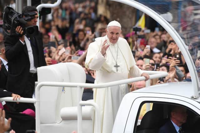 Pope Francis waves to the waiting crowds on College Green, Dublin on Saturday. Photo: Joe Giddens/PA Wire