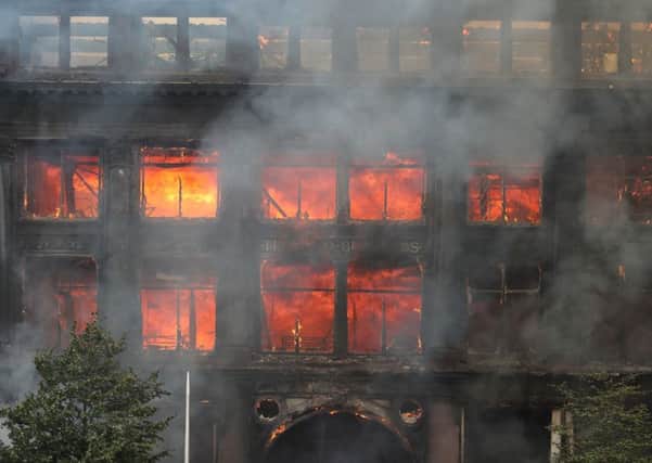 Flames from a major blaze which has broken out at the Primark store in Belfast city centre. PRESS ASSOCIATION Photo. Picture date: Tuesday August 28, 2018. The Northern Ireland Fire and Rescue Service is in attendance at the scene. See PA story ULSTER Fire. Photo credit should read: Liam McBurney/PA Wire