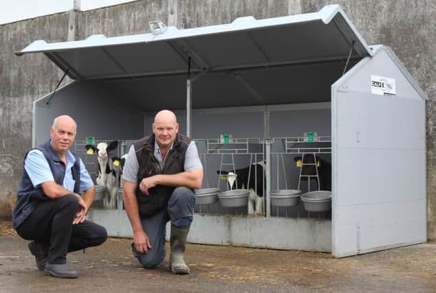 Ballymena dairy farmer John Barkley discusses the benefits of the CalfOTel movable single unit with agent Maurice Wylie,  Irwin Farm Supplies. Picture: Julie Hazelton