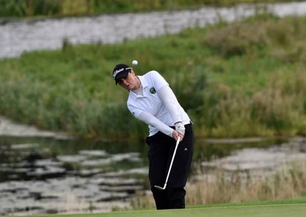 Ireland's Olivia Mehaffey pitches to the 18th green at Carton House on Wednesday.