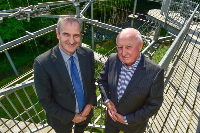 Marking the handover of Colin Glen Forest Park, Northern Ireland Environment Agency Chief Executive David Small and Chairman of the Colin Glen Trust David Raymond. A Community Asset Transfer, signed by both organisations, gives ownership to the Trust in the form of a 999 year lease. It will allow for greater funding and development opportunities for Colin Glen Forest Park.