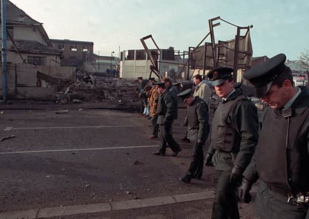 RUC officers pictured after an IRA attack on Glengormley RUC Station in 1992