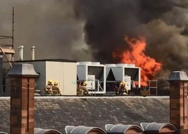 Dramatic footage of firefighters tackling the blaze on the roof top at Primark. See dramatic video footage online at: https://bit.ly/2wsIHid