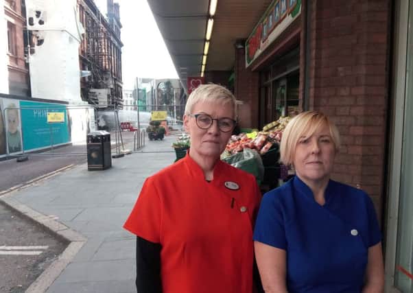 Primark fire disruption has badly affected some traders outside the safety cordon in Belfast city centre. Pat Moore (left) and Jean McNair of Conway Opticians in Castle Street have complained of the street being like a "ghost town" with trade decimated.
