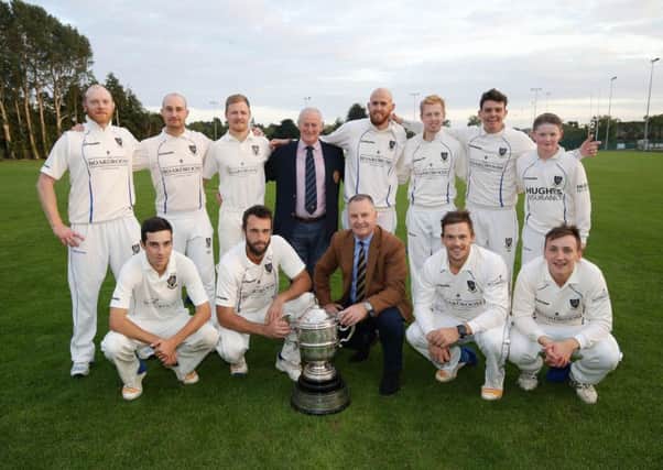 CIYMS celebrate Robinson Services Premier League trophy joy with David Robinson (front row, Robinson Services) and Clarence Hills (back row, NCU president). Pic by PressEye Ltd.