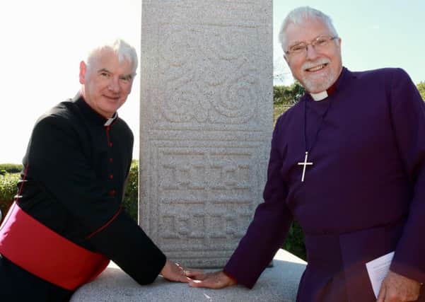 Catholic Bishop Noel Treanor and Bishop Harold Miller (Church of Ireland) at the dedication of a replica of an ancient St Patrick's Cross at Down Cathedral