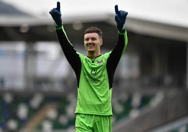 Ards keeper Sam Johnston celebrates after Saturday's game at Windsor Park. Photo Charles McQuillan/Pacemaker Press