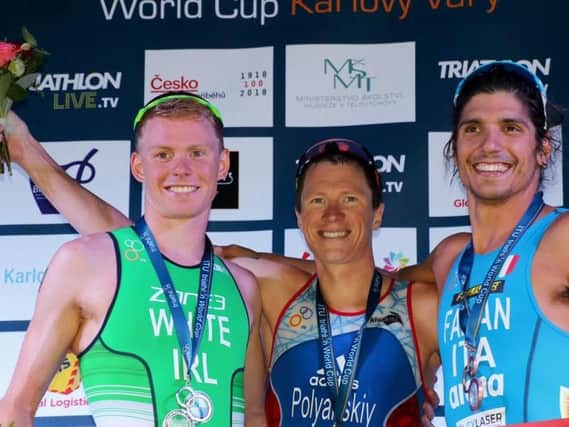 Banbridge triathlete Russell White (left) with his silver medal at thethe ITU World Cup race at Karlovy Vary in the Czech Republic on Sunday.