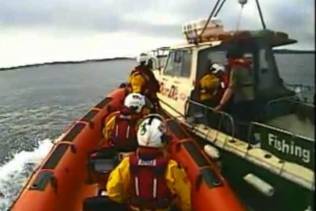RNLI approach the boat to rescue a Northern Ireland man who had been bitten by a shark