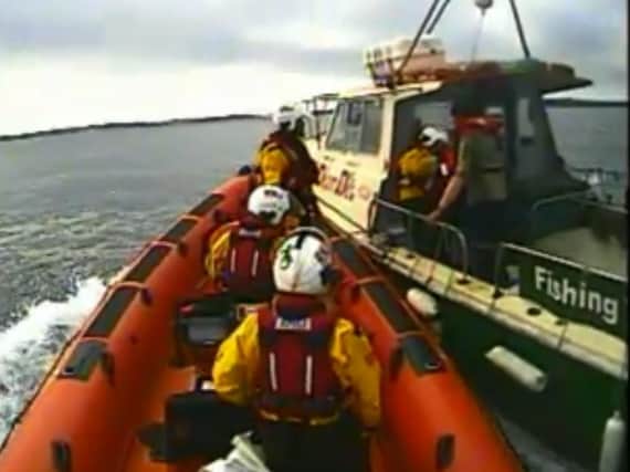 RNLI approach the boat to rescue a Northern Ireland man who had been bitten by a shark