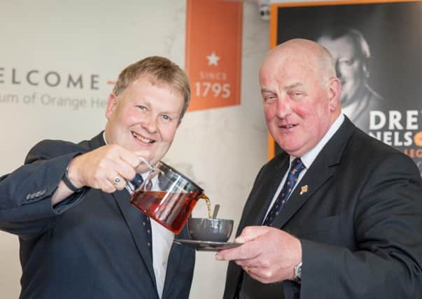 Want a brew? Deputy Grand Master Harold Henning pours a hot drink for Grand Master Edward Stevenson ahead of the Province-wide coffee morning later this month in aid of the Drew Nelson legacy project. Photo by Graham Baalham-Curry