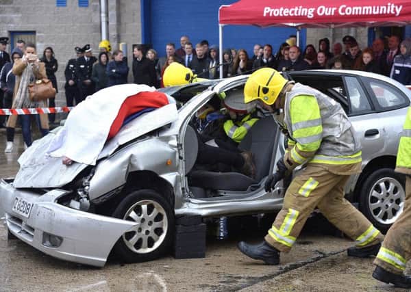 Fire service and police stage a reconstruction of a road traffic collision at Belfast's Risk Avoidance and Danger Awareness Resource
(RADAR) centre.