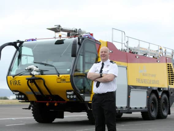 Seamus MacMahon, Chief Fire Officer and Head of Emergency Planning at George Best Belfast City Airport (pictured) takes delivery of the first of three new fire tenders.