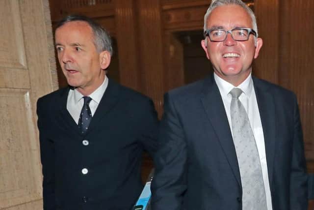 Solicitor Denis Moloney and his client, former DUP minister Jonathan Bell (right) as they arrive at the RHI inquiry at Stormont Parliament buildings in Belfast.