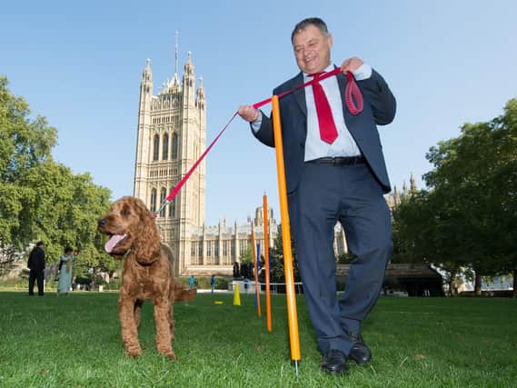 Mike Amesbury MP with Cockapoo, Corbyn, winner of the Pawblic Vote award during the 26th annual Westminster Dog of the Year competition, which was won by Boomer and Corona, belonging to Alex Norris MP