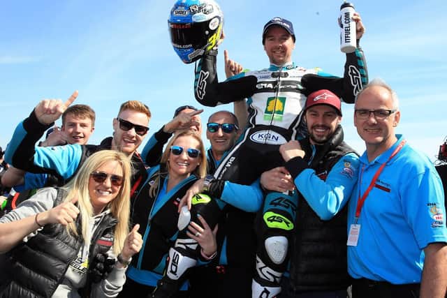 Alastair Seeley celebrates his double success in the Supersport races at the North West 200 with the EHA Racing team.