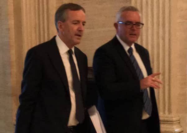 Solicitor Denis Moloney and his client, former DUP minister Jonathan Bell (right) as they arrive for his second day of evidence at the RHI inquiry at Stormont Parliament buildings in Belfast.
