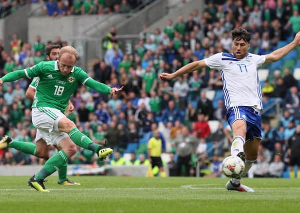 Northern Irelands Liam Boyse shoots for goal on Saturday