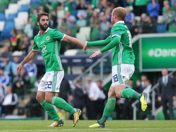 Northern Ireland striker Will Grigg celebrates with Liam Boyce, after scoring against Bosnia and Herzegovina.