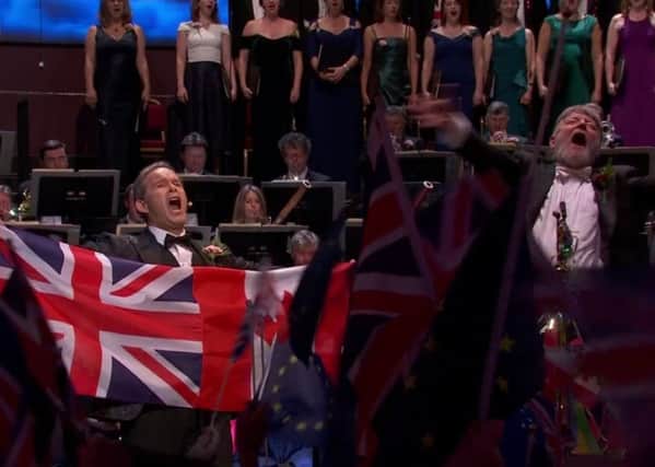 Baritone Gerald Finley and conductor Sir Andrew Davis during the traditional renditional of Rule Britannia on Saturday. But it was not shown on the screen in Northern Ireland. Screengrab from BBC