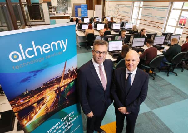 Alchemy founder John Harkin pictured, right, at the firms offices with Invest NI CEO Alastair Hamilton