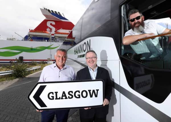 Aodh Hannon pictured with Ian Baillie of Stena and driver Jim McAlorum