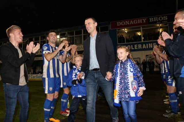 Oran Kearney and his kids receive a guard of honour from the players and staff.