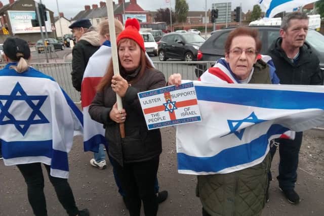 Residents from The Village in south Belfast showing their support for the people of Israel as pro-Palestine demonstrators staged a protest on the opposite side of the Westlink ahead of Northern Ireland's game against Israel at Windsor Park.