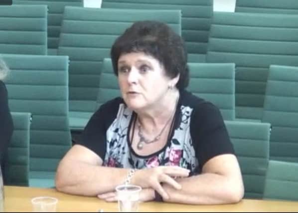 Roisin Foster, Chief Executive of Cancer Focus Northern Ireland speaking in front of the NI Affairs Committee