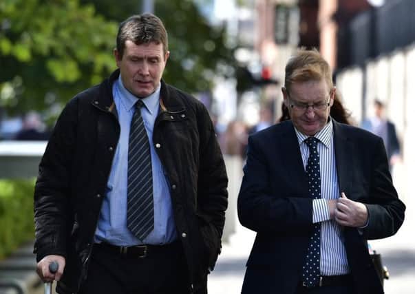 The coroner addressed concerns from Willie Frazer, right. Left is Colin Worton, whose brother Kenneth was killed in the massacre.
Photo: Colm Lenaghan/Pacemaker Press