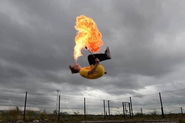 Ryan Luney, a three time Guinness World Record holder pictured in Belfast doing backflips while firebreathing. 
Pic Colm Lenaghan/Pacemaker