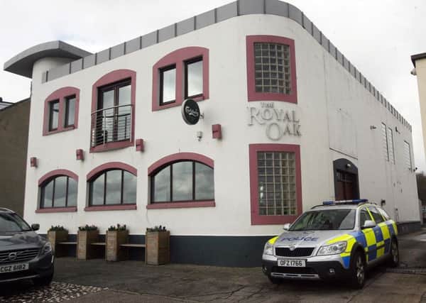 The Royal Oak at Carrick seafront, which stands immediately next door to a police station