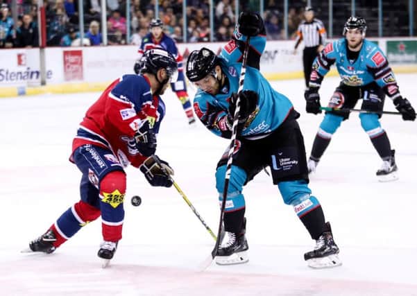 Belfast Giants David Rutherford with Dundee Stars Drydn Dow