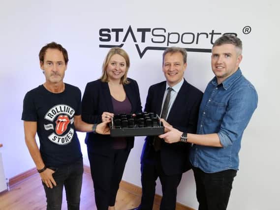 Statsports founders Alan Clark, left, and Sean O'Connor, right, are pictured with Jeremy Fitch, Invest NI and Secretary of State Karen Bradley.