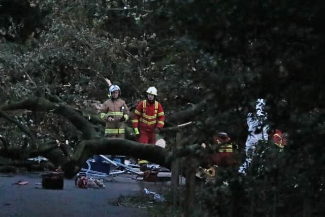 Emergency services and a forensic officer at Slieve Gullion forest park in Co Armagh, where 24-year-old Matt Campbell died after he was hit by a falling tree during Storm Ali. photo: Brian Lawless/PA Wire