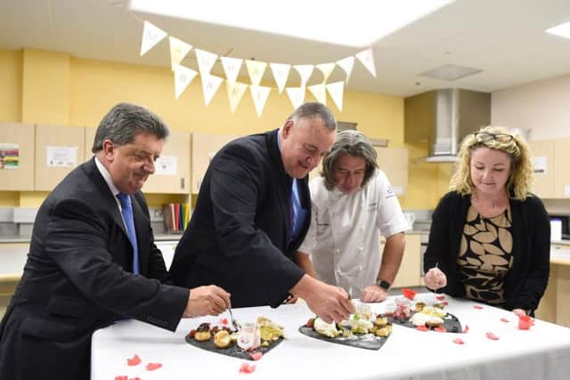 Director General of NI Prison Service Ronnie Armour, Governor Dave Kennedy and Gillian Winters, Head of Learning at Belfast Metropolitan College, join Michael Deane at the judging table for the Maghaberry Bake-Off final. Picture: Michael Cooper