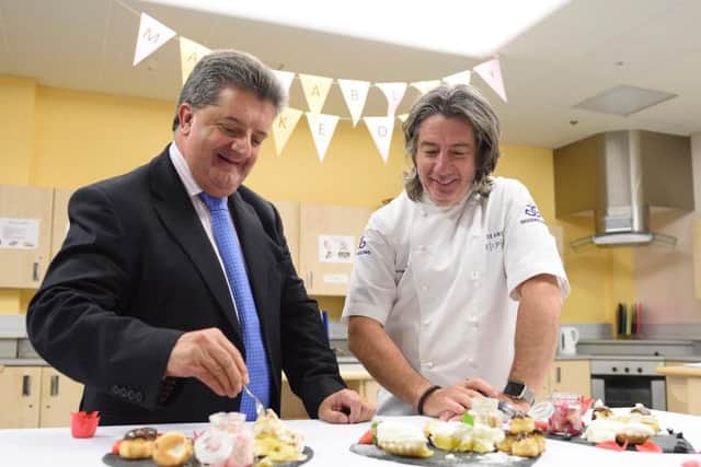 Director General of NI Prison Service Ronnie Armour joins Michael Deane at the judging table for the Maghaberry Bake-Off final. Picture: Michael Cooper