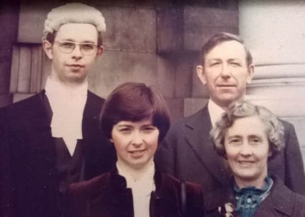 Edgar Graham, on the day he was called to the Bar of Northern Ireland, left, with his sister Anne centre and father Norman and mother Anna
