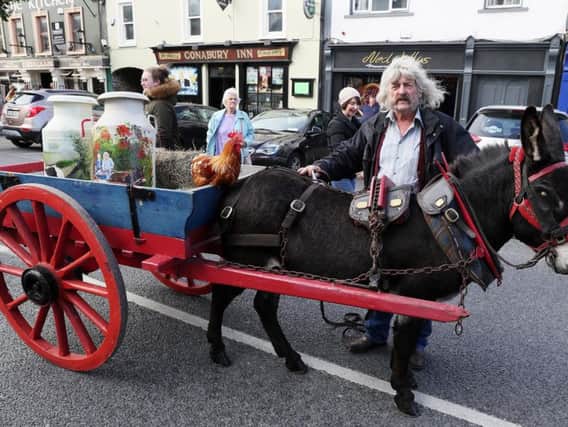 Johnney Fee, from Dungannon, arrives for the unveiling of a statue of late country singer Big Tom McBride in Castleblaney as the inaugural festival in his honour concludes