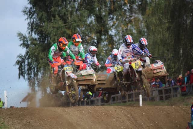 Gary Moulds and Steve Kirwin (23)  battle with Brett Wilkinson and Dan Chamberland (11)  and Willy Bouqet and  Pavel Boukal (5) at the Sidecarcross of Nations in Denmark.