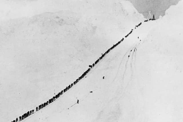 Gold prospectors ascend the Chilkoot Trail during the Klondike Gold Rush