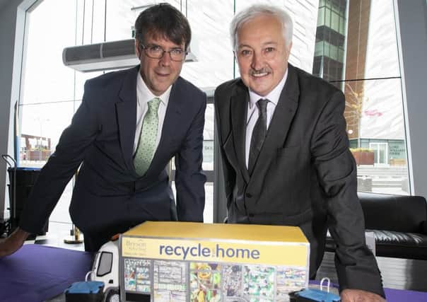 Bryson Charitable Group CEO John McMullan, right, with Bryson Recycling director Eric Randall