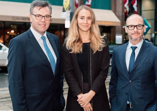 Mr Hamilton, left,  with Dana Dickerson of the Canadian Department for International Trade  and Kevin McGurgan, British Consul General in Toronto