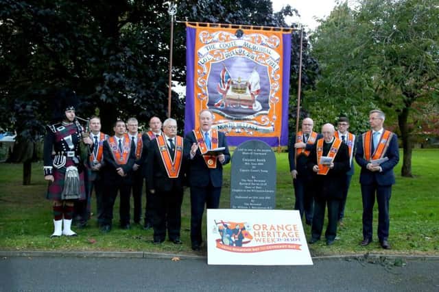 Orangemen pay their respects at the grave of Corporal Smith who fought at the Battle of the Boyne