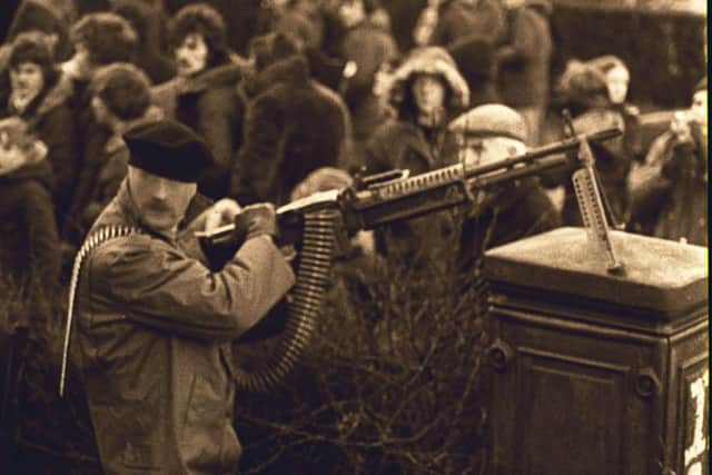An IRA gunman displays M60 Machine Gun on streets of Londonderry in 1978