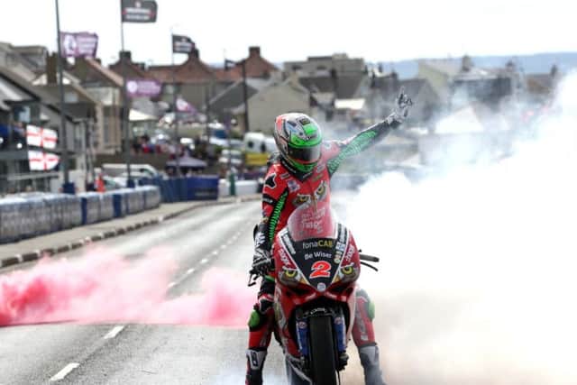 Glenn Irwin celebrates his double success at the North West 200 in May.